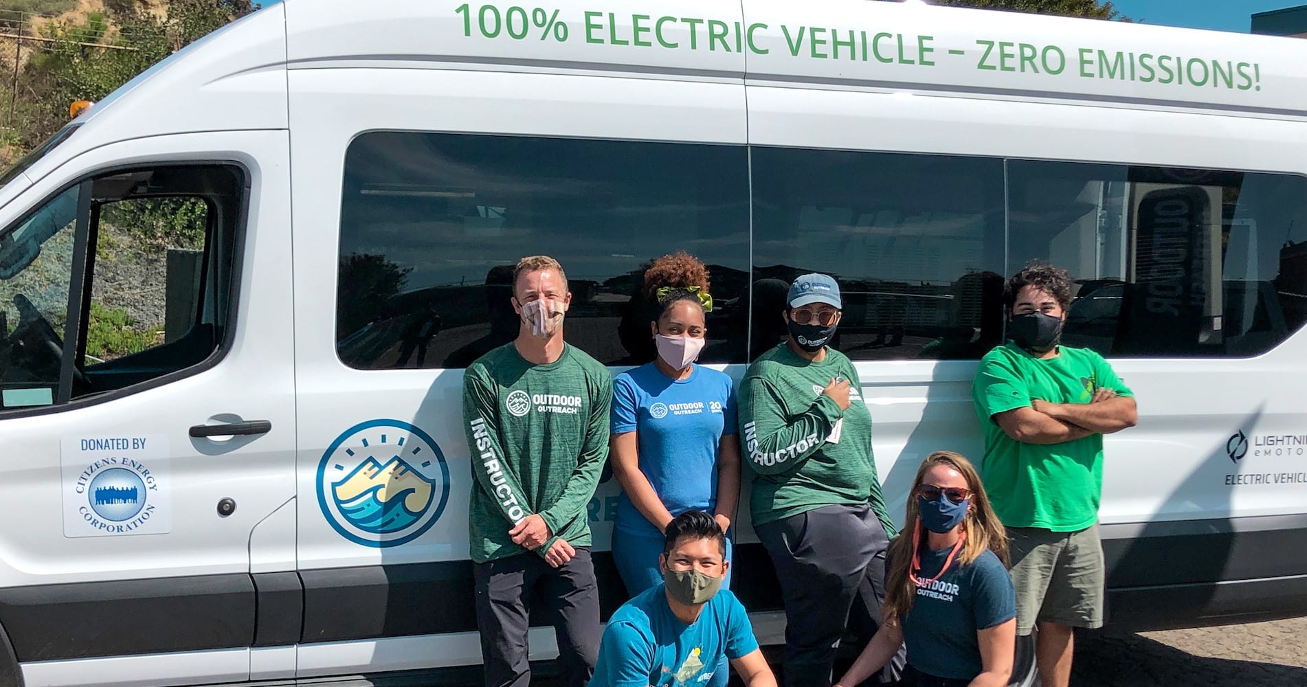 Outdoor Outreach youth with an electric van